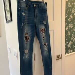 Distressed Blue Women’s Jeans with Leopard Patch Detail